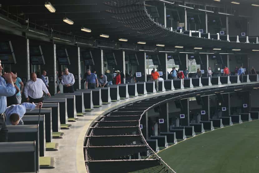 Patrons enjoy themselves at media night at the new TopGolf in Fort Worth in April.