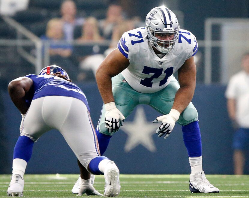 FILE - Dallas Cowboys offensive tackle La'el Collins (71) liens up against the New York...