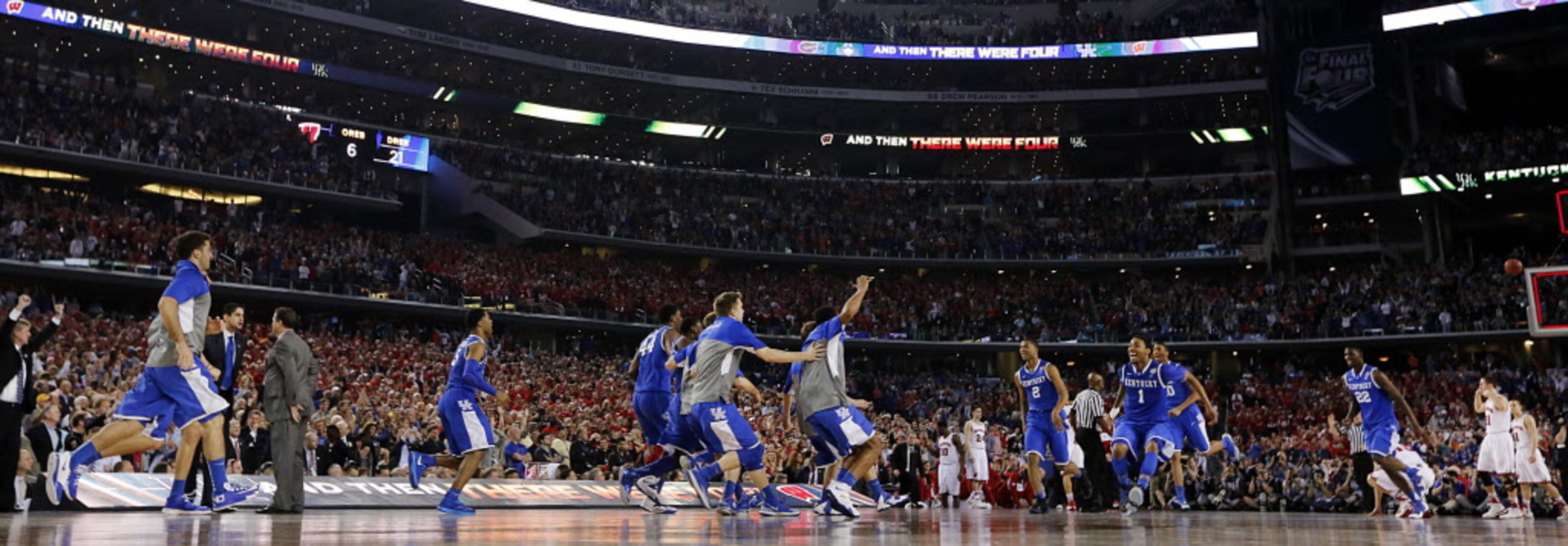 The Kentucky Wildcats celebrate their 74-73 win over the Wisconsin Badgers in their...