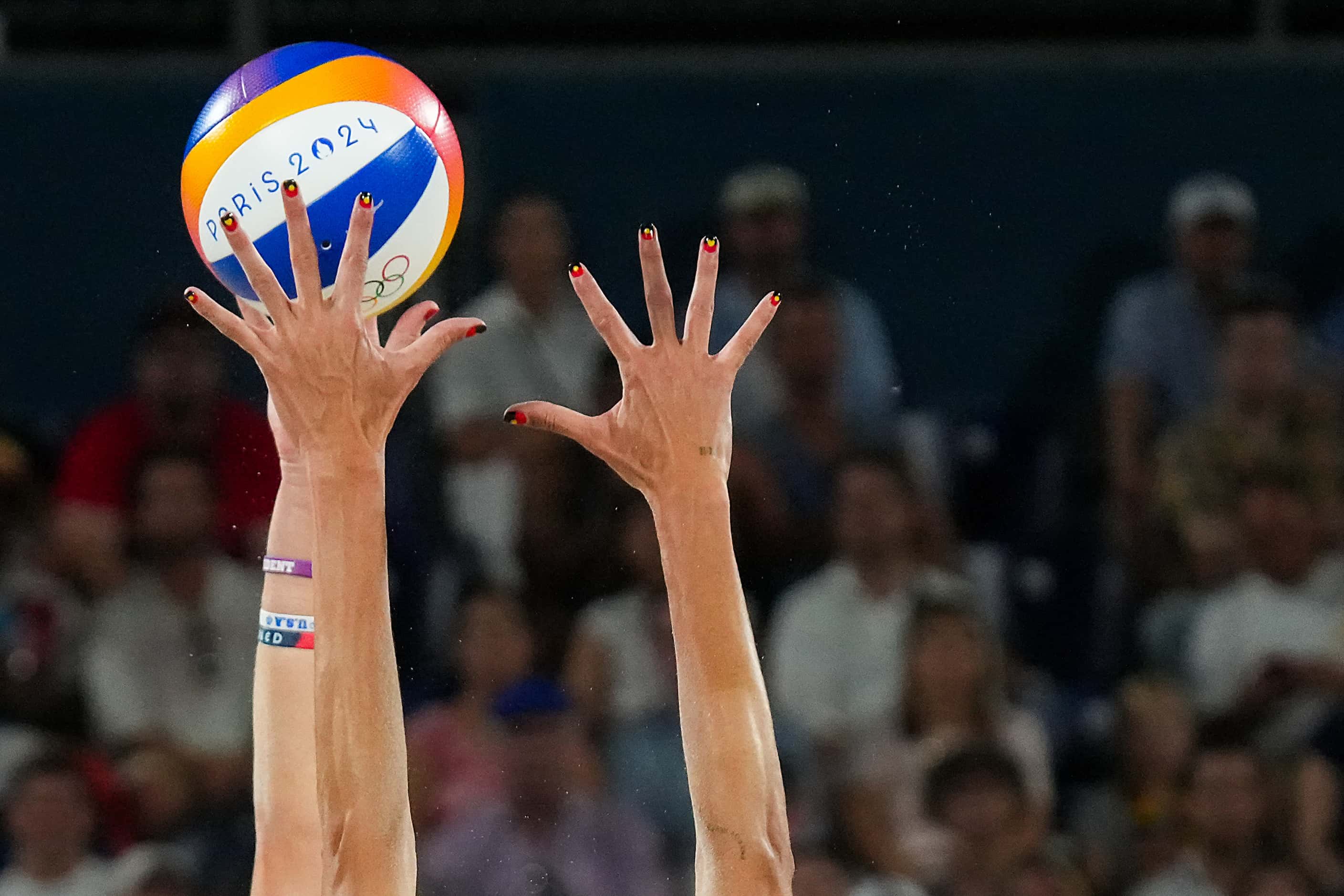 Taryn Kloth of the United States spikes the ball against Australia in women’s beach...