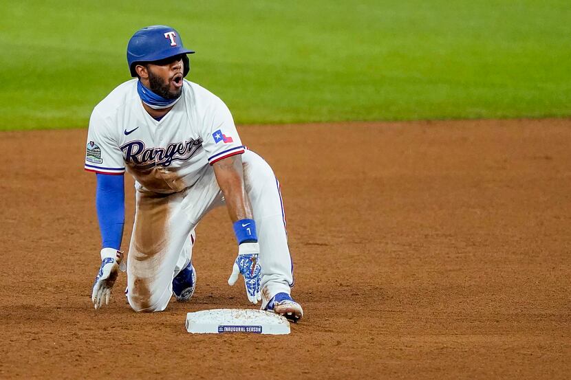 Texas Rangers shortstop Elvis Andrus reacts after being called out on a steal attempt during...