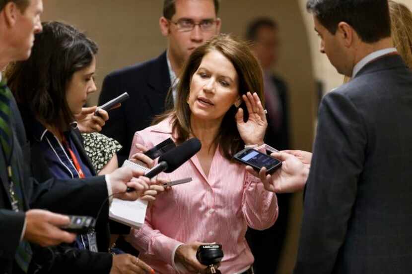 
Rep. Michele Bachmann, R-Minn., was surrounded by reporters on Capitol Hill Aug. 1 as she...