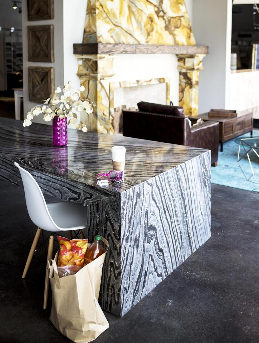 A custom crafted table made of Silver Wave marble pairs nicely with classic modern furnishings.
