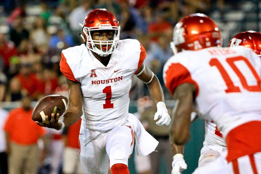 Oct 16, 2015; New Orleans, LA, USA; Houston Cougars quarterback Greg Ward Jr. (1) tosses the...