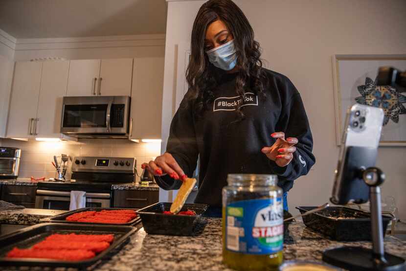 NaTasha Peck, creator of the YouTube channel ToshPointFro, creates Hot Cheetos fried pickle...