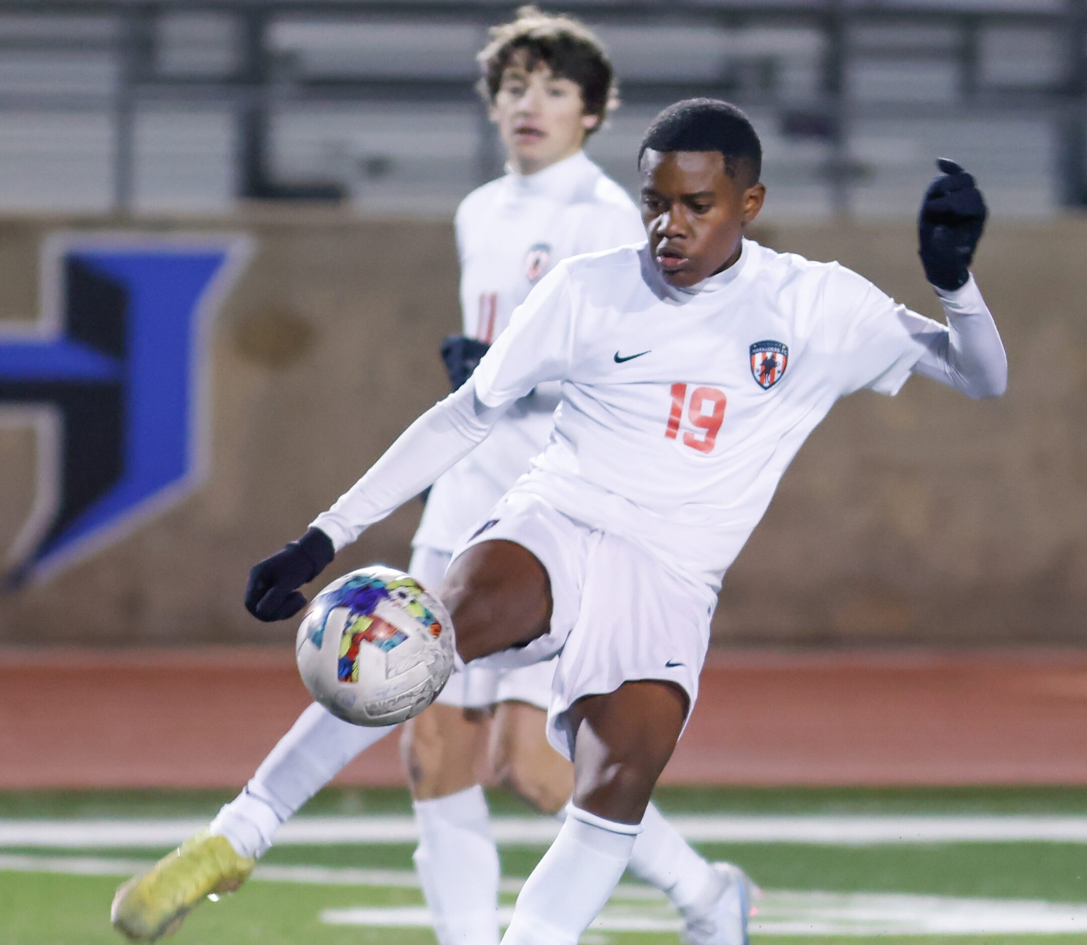 Flower Mound Marcus’ Kana Dube (19) lifts his leg to trap the ball in the second half of a...