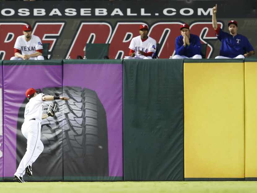 Texas Rangers center fielder Drew Stubbs (15) catches a fly ball from Detroit Tigers second...