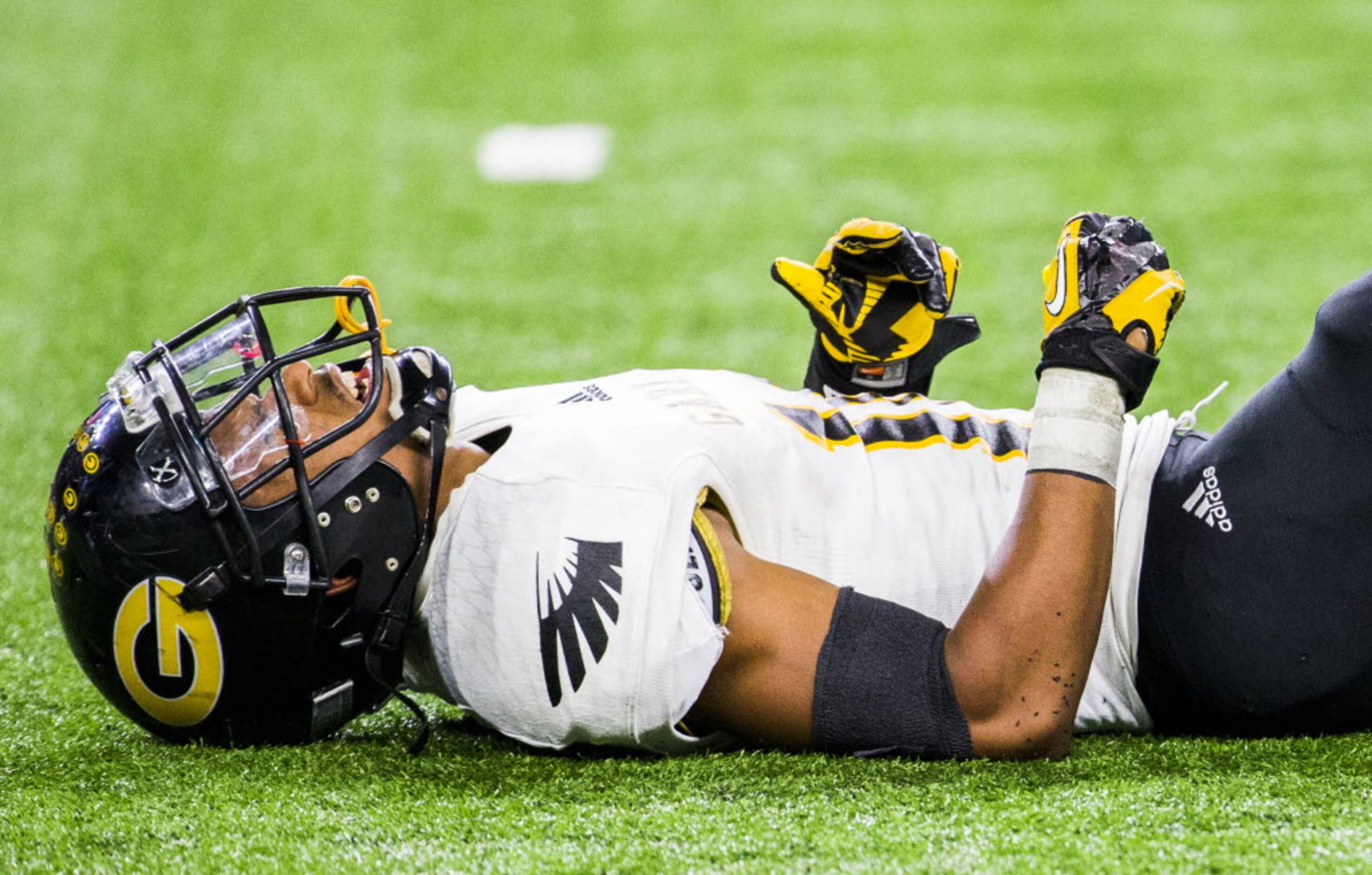 Garland wide receiver Josh Thompson (10) is slow to get up after a play during the fourth...