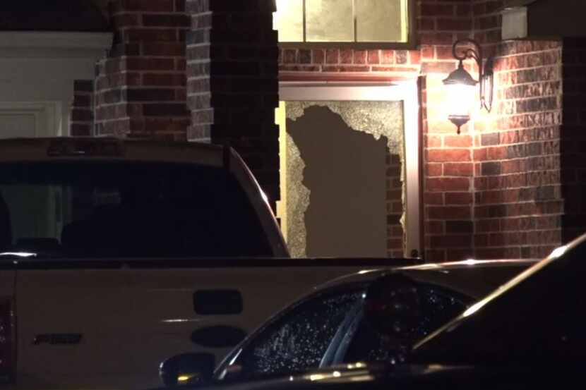 The front door of a home in southwest Fort Worth was shattered Wednesday morning after a...