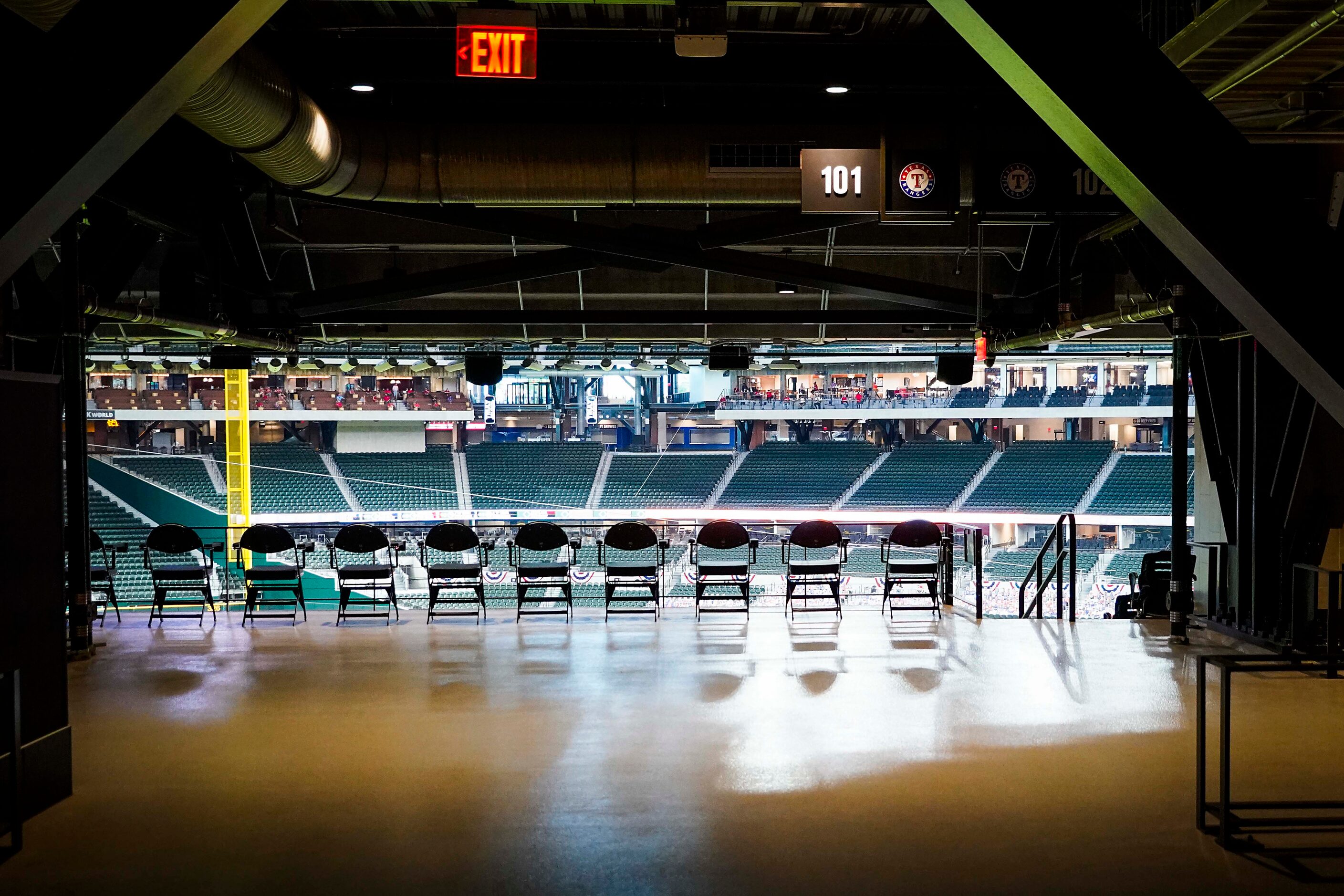 Seat sit empty as the Texas Rangers face the Colorado Rockies on opening day at Globe Life...