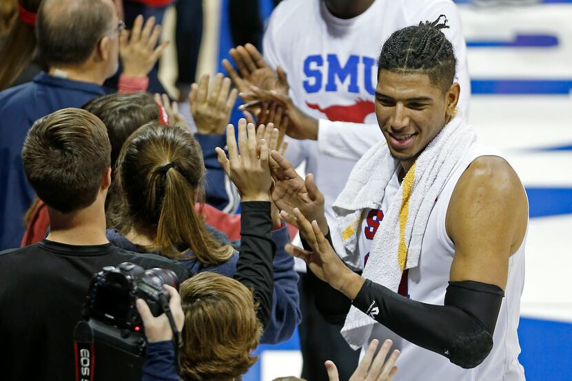 SMU forward Everett Ray (24) celebrates a 72-37 win over Arkansas-Pine Bluff with fans at...