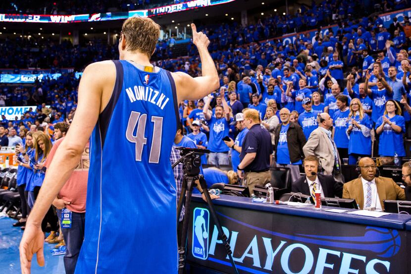 Dallas Mavericks forward Dirk Nowitzki (41) gives the Oklahoma City Thunder crowd a thumbs...