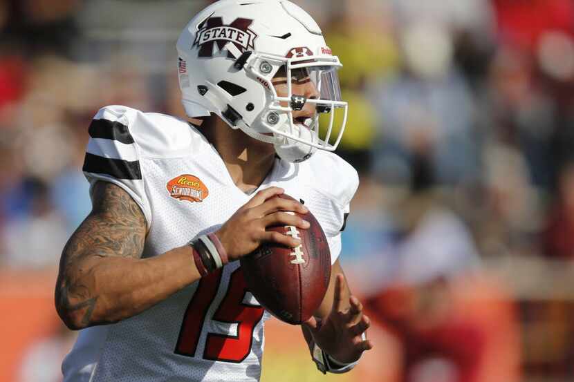 South Team quarterback Dak Prescott, of Mississippi State, looks to pass during first half...