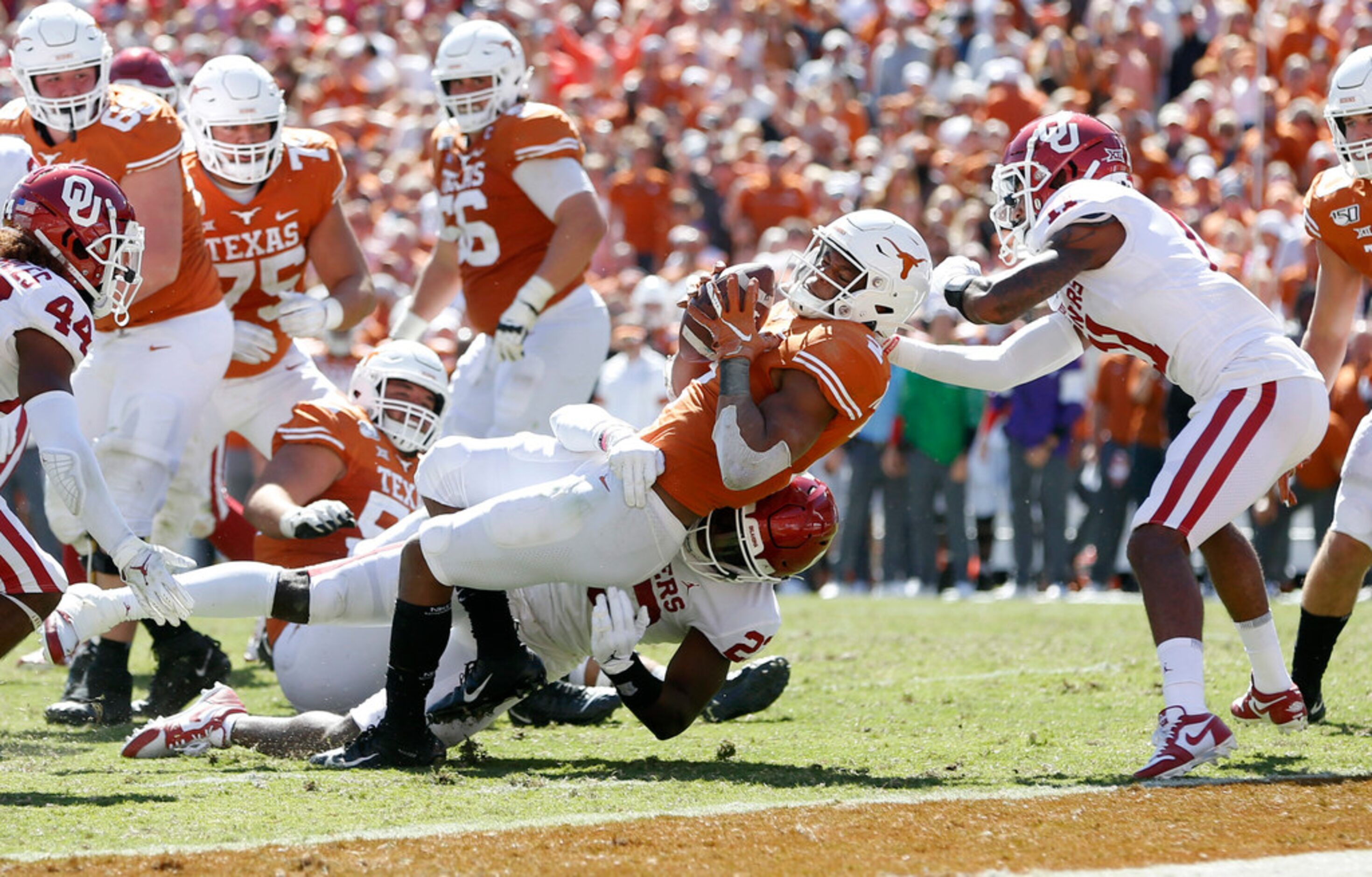 Texas Longhorns quarterback Roschon Johnson (2) scores a touchdown as Oklahoma Sooners...