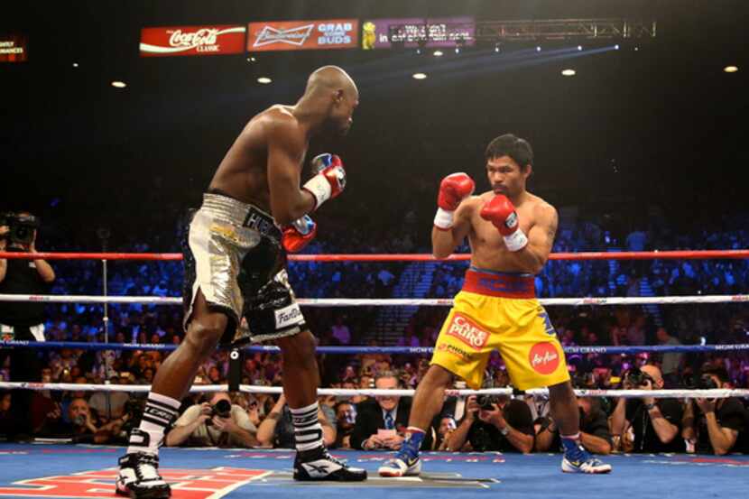 Manny Pacquiao (right) fights Floyd Mayweather at the MGM Grand Garden Arena in Las Vegas.
