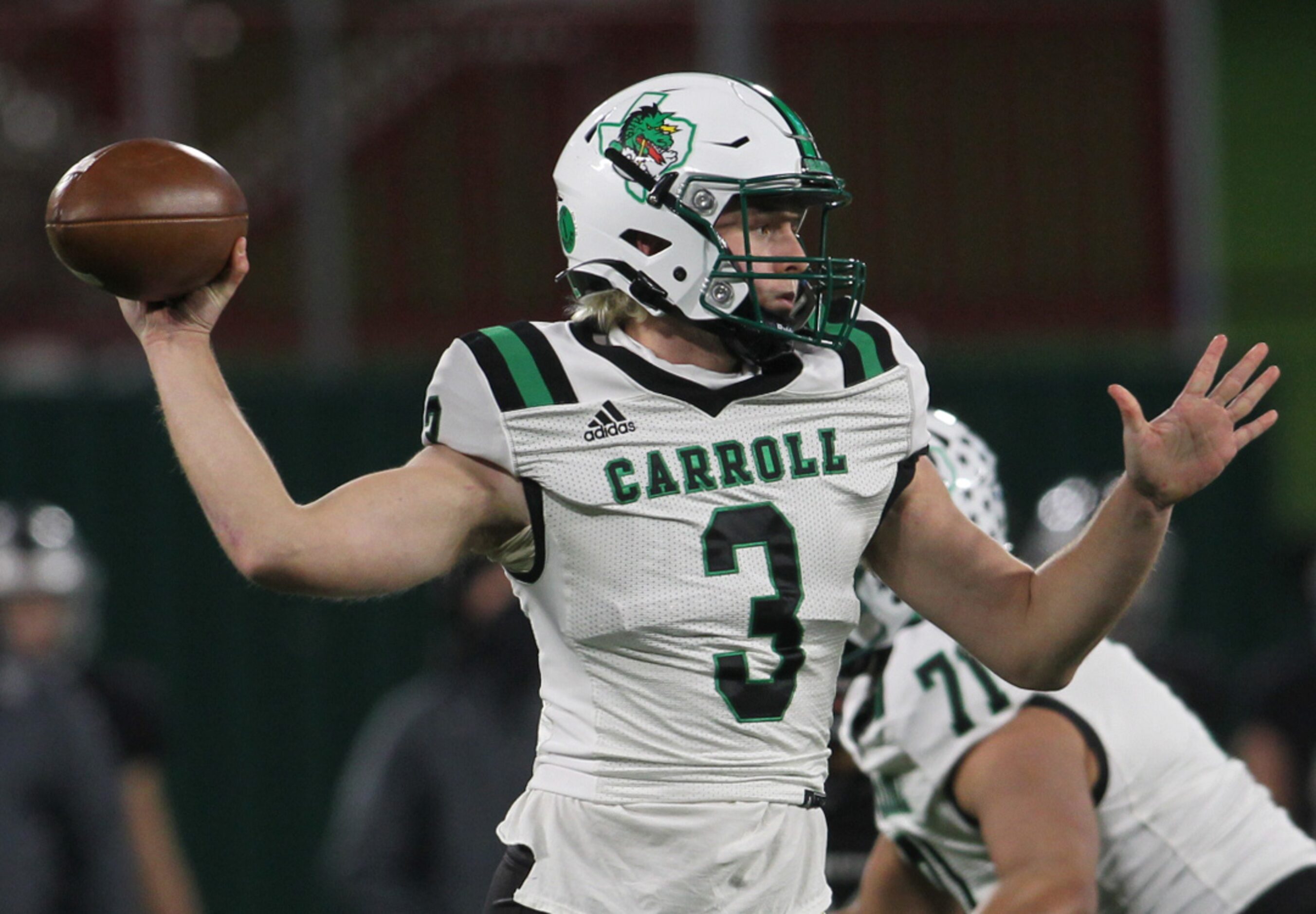 Southlake quarterback Quinn Ewers (3) passes downfield during first quarter action of their...