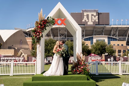 Morgan Meador and Rodney Oliver tied the knot at Kyle Field after winning a contest by Dos...