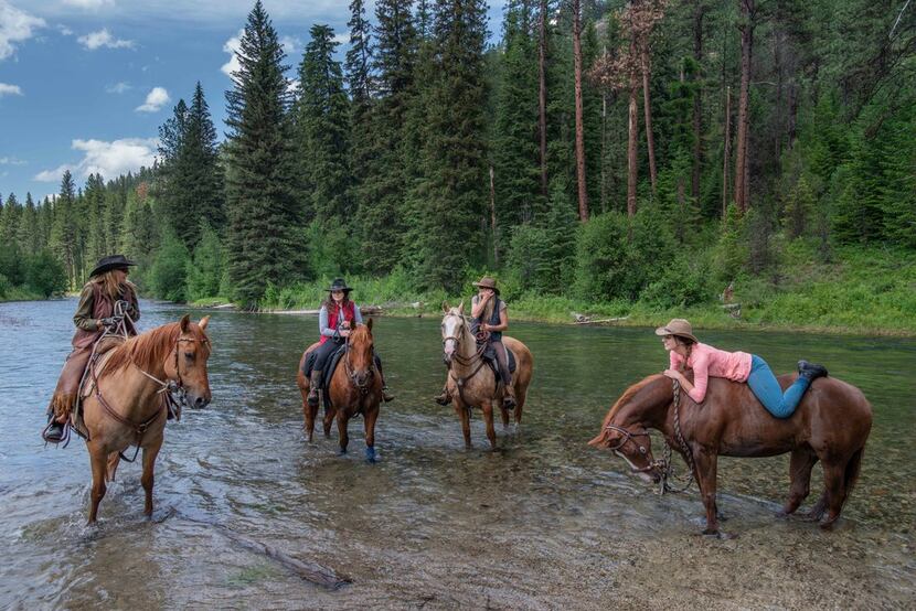 Horseback riders hit the trail — and the river — near the Minam River Lodge. 