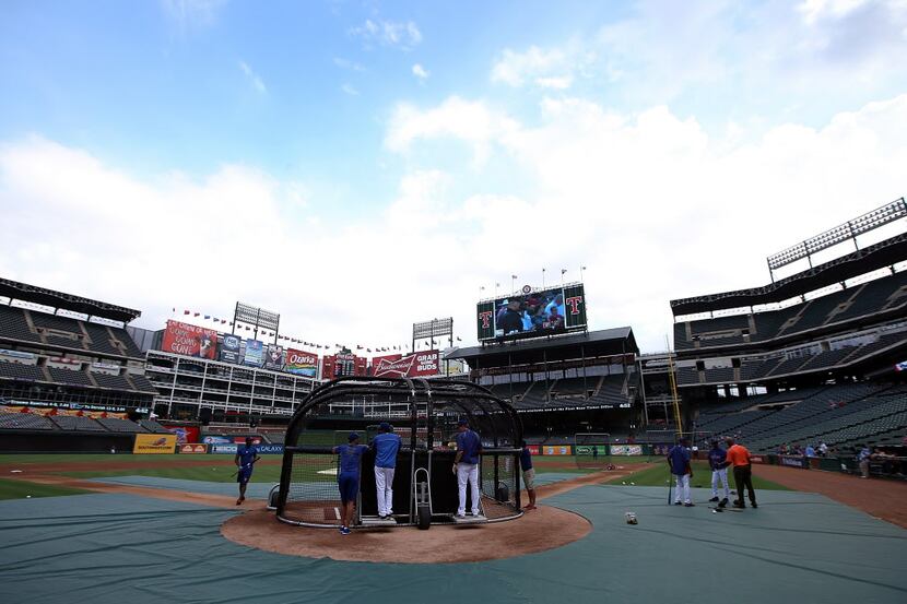 ARLINGTON, TX - AUGUST 14: The Texas Rangers take batting practice prior to the start of the...