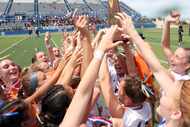 Frisco Wakeland players celebrate with their state championship trophy following their 3-2...