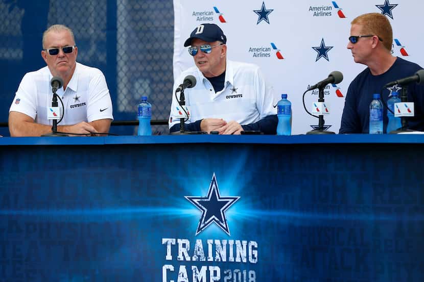 Cowboys owner Jerry Jones, center, answers questions as head coach Jason Garrett, right, and...