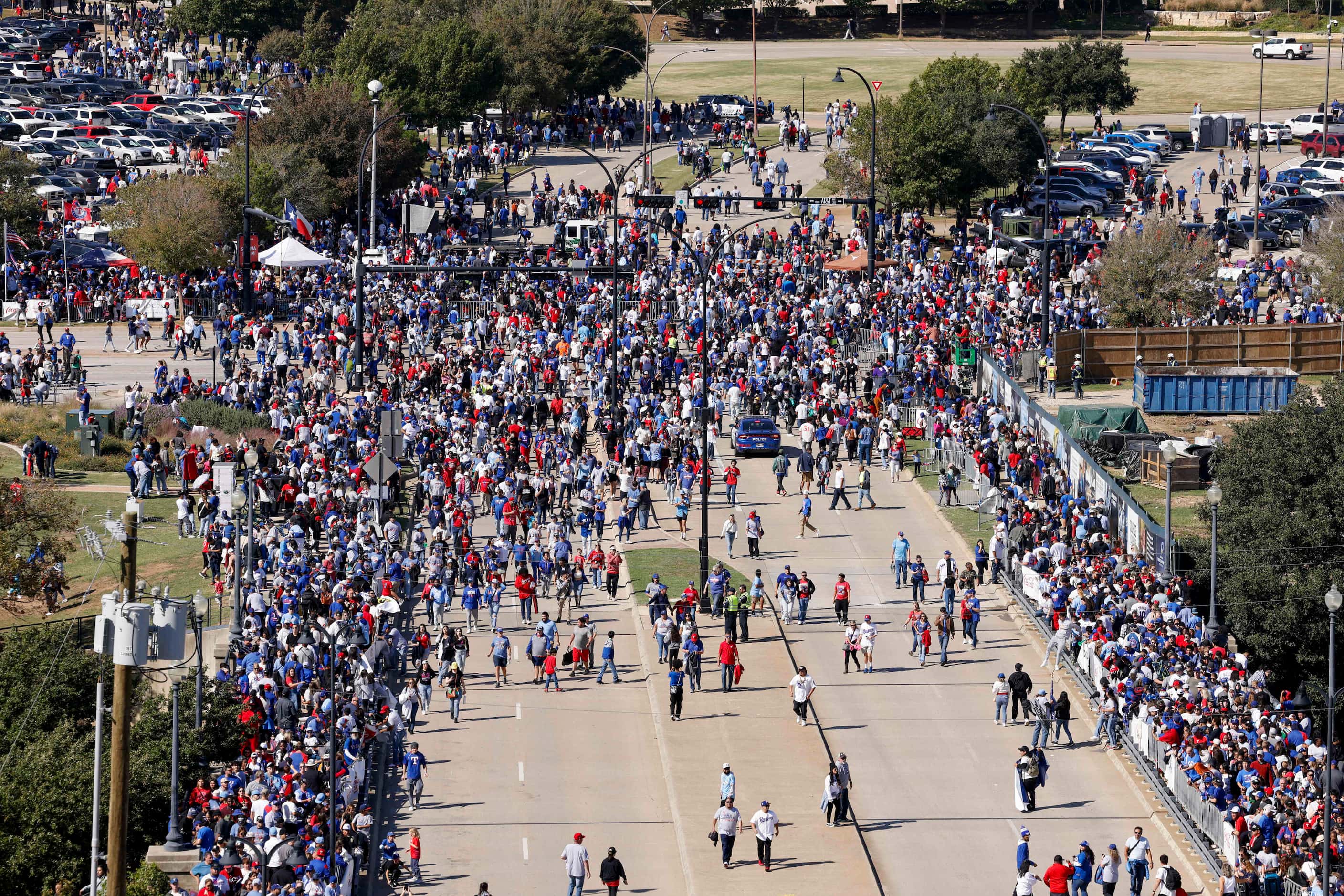 Fans fill the street as they head to the ceremony after the Texas Rangers World Series...