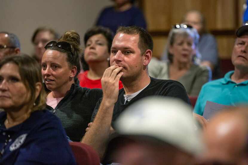 Frank Hall listens to council member comments during the city council meeting in Ferris,...