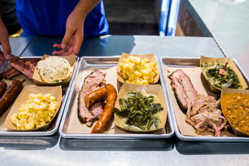 Three combo platters are served at Heim Barbecue's new location on Saturday, August 6, 2016...