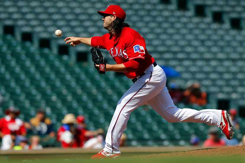 Texas Rangers relief pitcher Cory Gearrin (44) came in to close out their win against the...