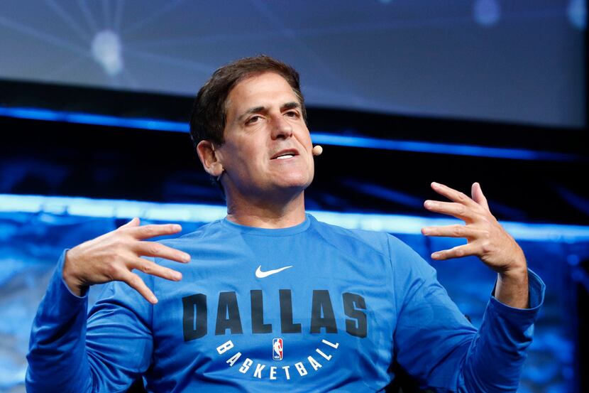 
Dallas Mavericks owner Mark Cuban, right, answers question from Scott Murray during the...