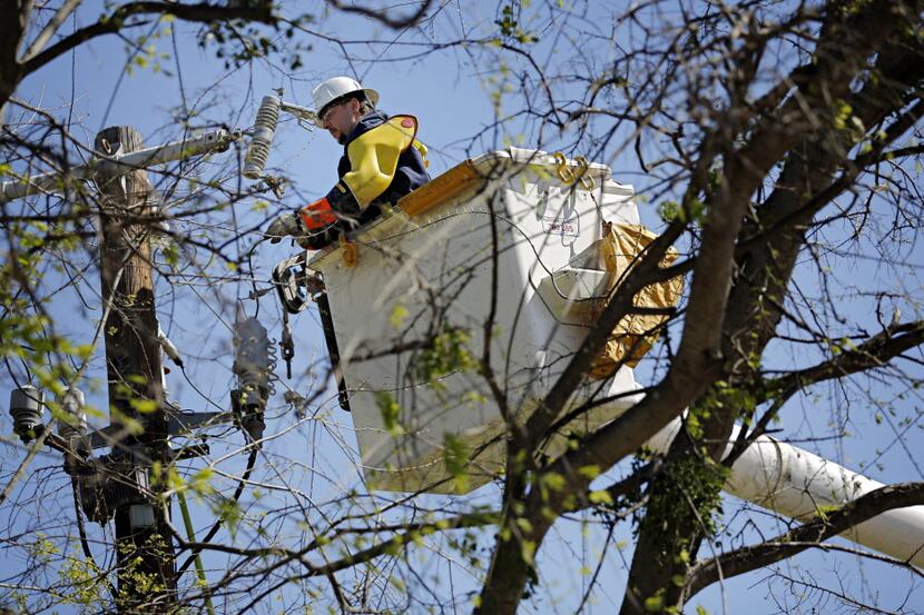 Oncor workers fix an outage near Ferguson and Buckner Roads in 2016.