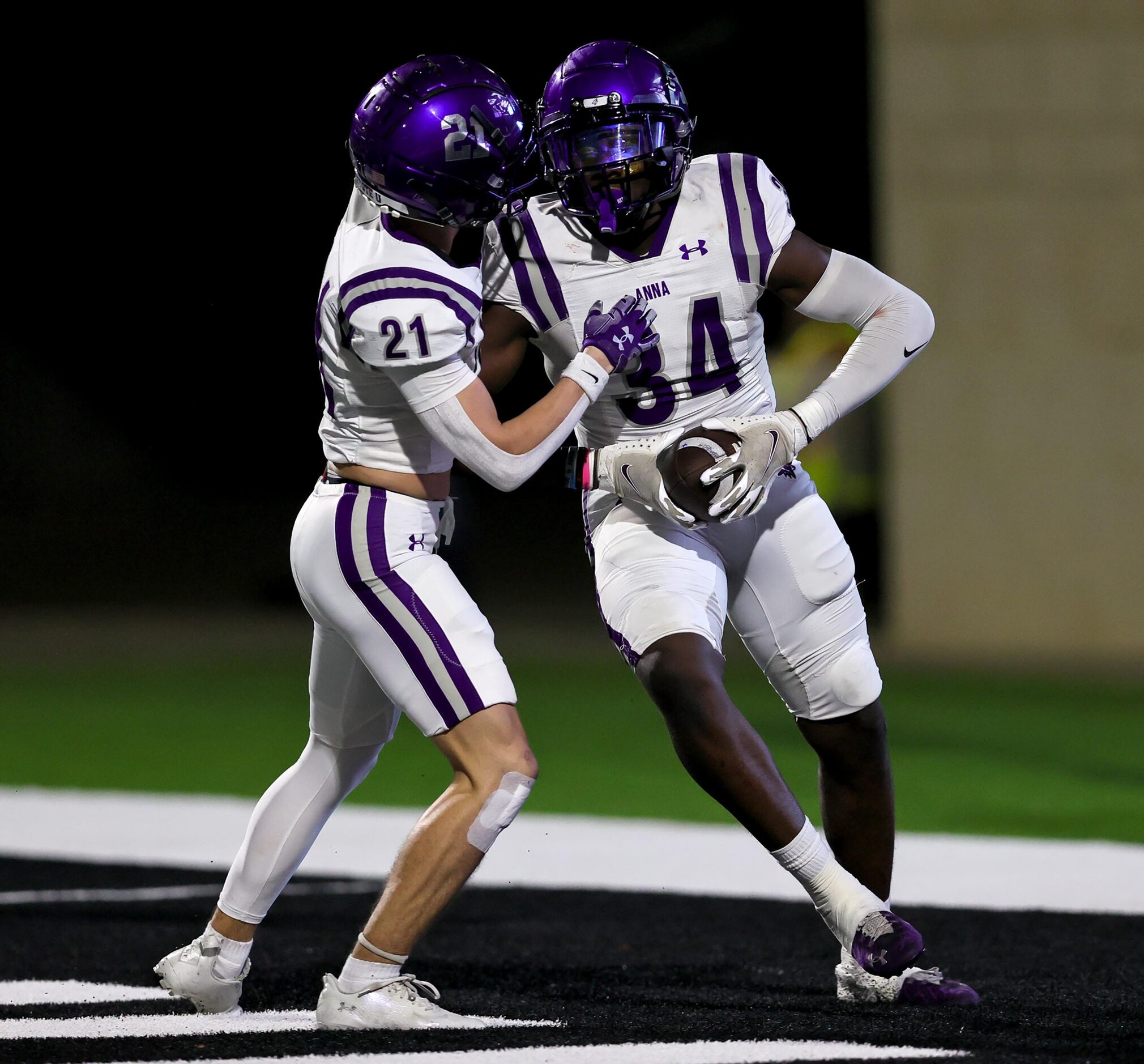 Anna linebacker Brandon Green (34) celebrates with safety Roman Frazier (21) after Green...