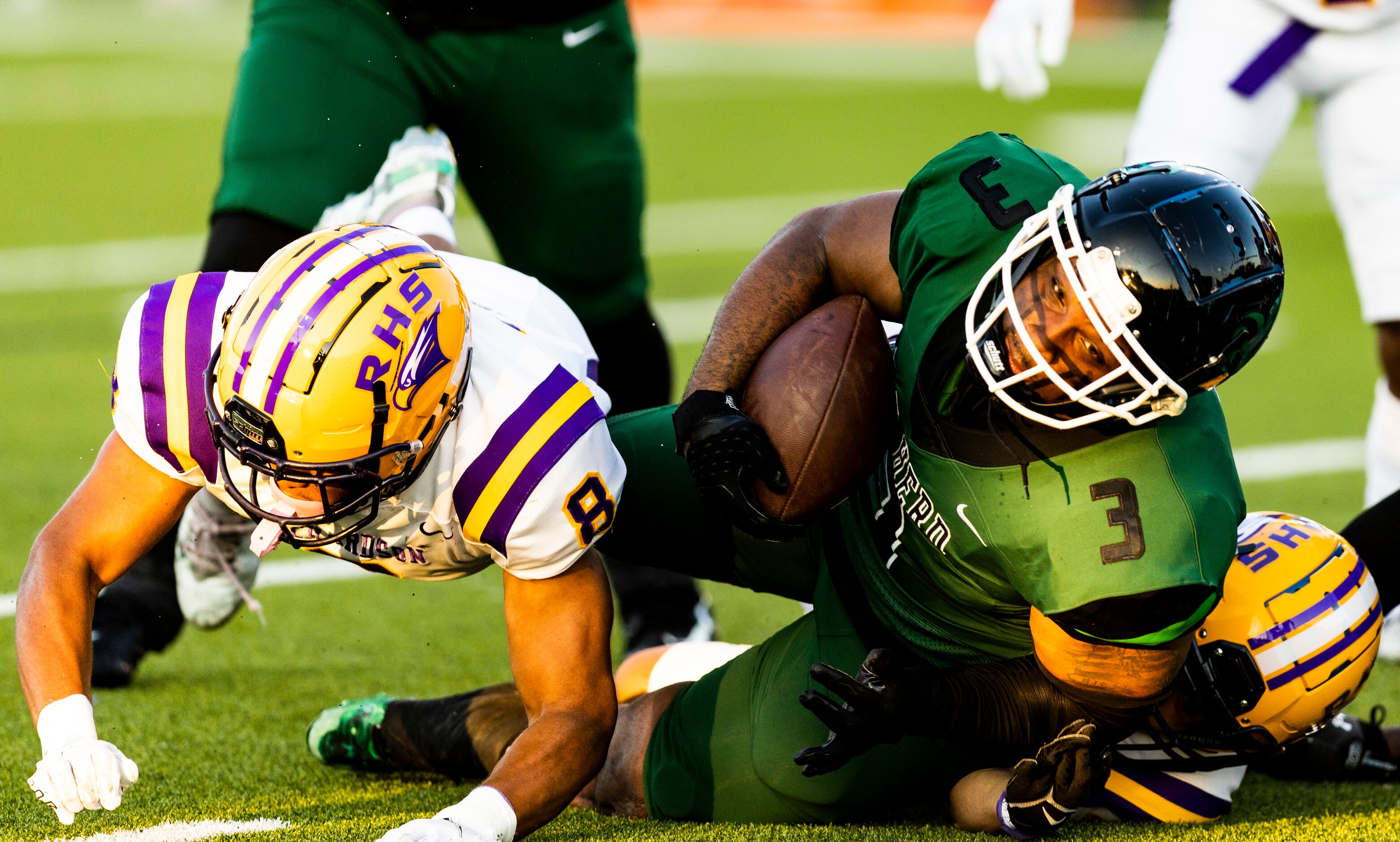 Berkner junior running back Kaden Alcorn (3) is tackled by Richardson senior Malachi...