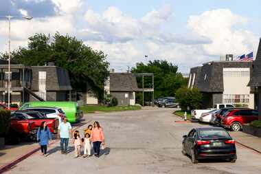 Former Wingren Village Apartments residents Aisha U-Kiu (left), Mohammed Humayoun Butt...