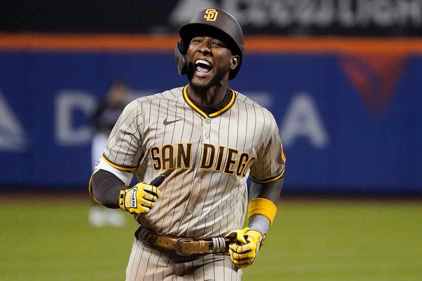 San Diego Padres Jurickson Profar reacts as he rounds the bases after hitting a three-run...