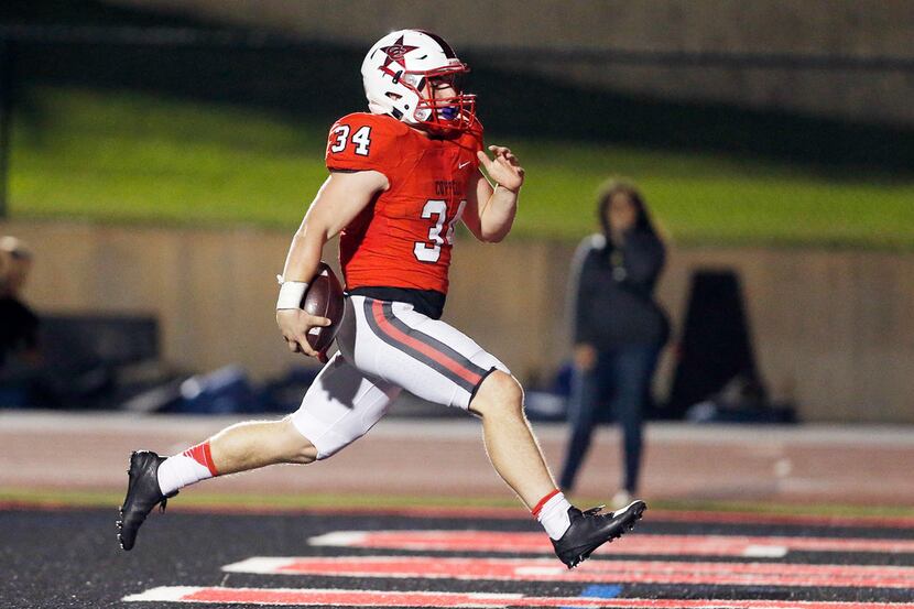 TXHSFB Coppell junior running back Ryan Hirt (34) scores a touchdown during the first half...