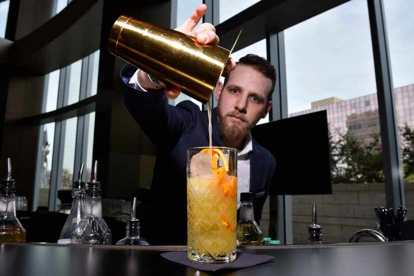 Bartender Tyler Upshaw prepares a Grove nonalcoholic cocktail with Seedlip grove at the...