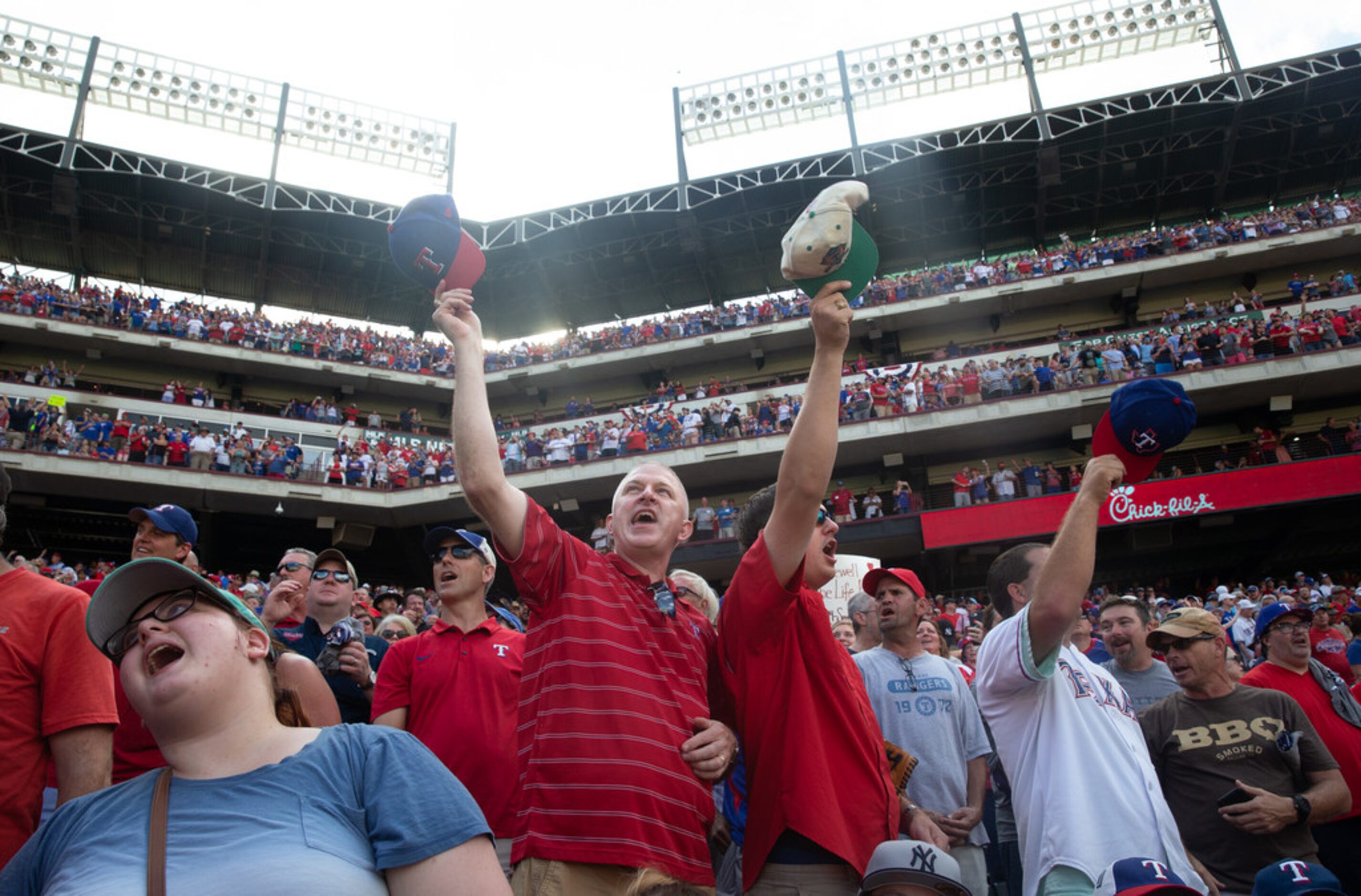 Frank Targac (left) sings one last "Take Me Out to the Ballgame" with his son, Allen Targac...