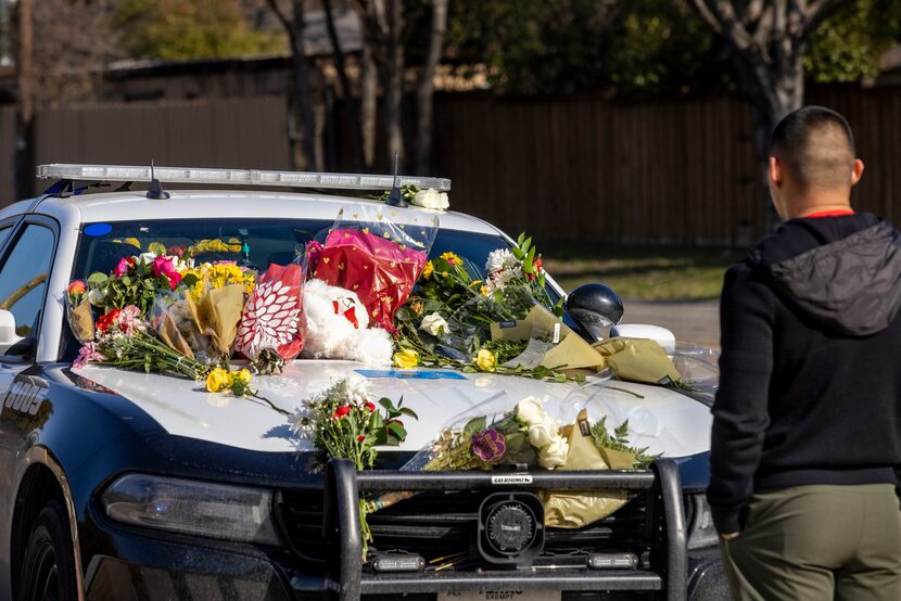 Edgar Campos pays respects to fallen Dallas police Officer Mitchell Penton. The two were...