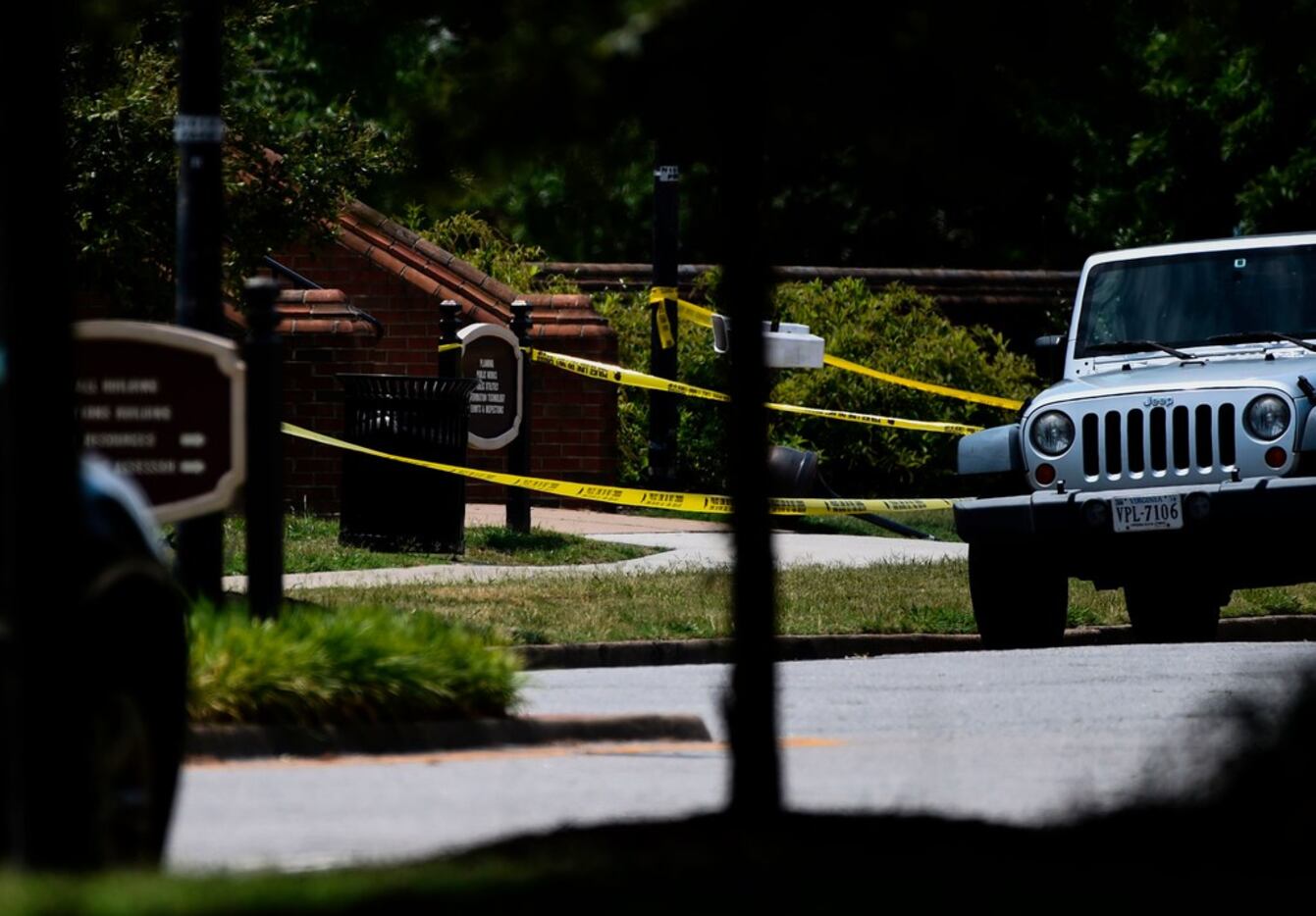 Police tape is seen near building number 2 at the Virginia Beach Municipal Center, the scene...