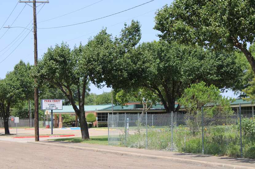 A company placed fencing around a garden at Park Crest Elementary School on July 23. (Sophie...