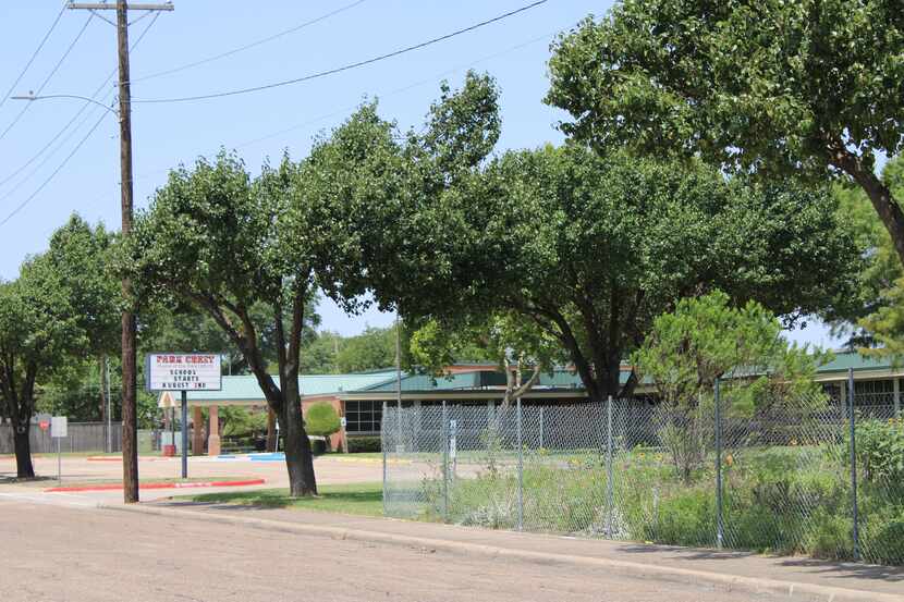 A company placed fencing around a garden at Park Crest Elementary School on July 23.