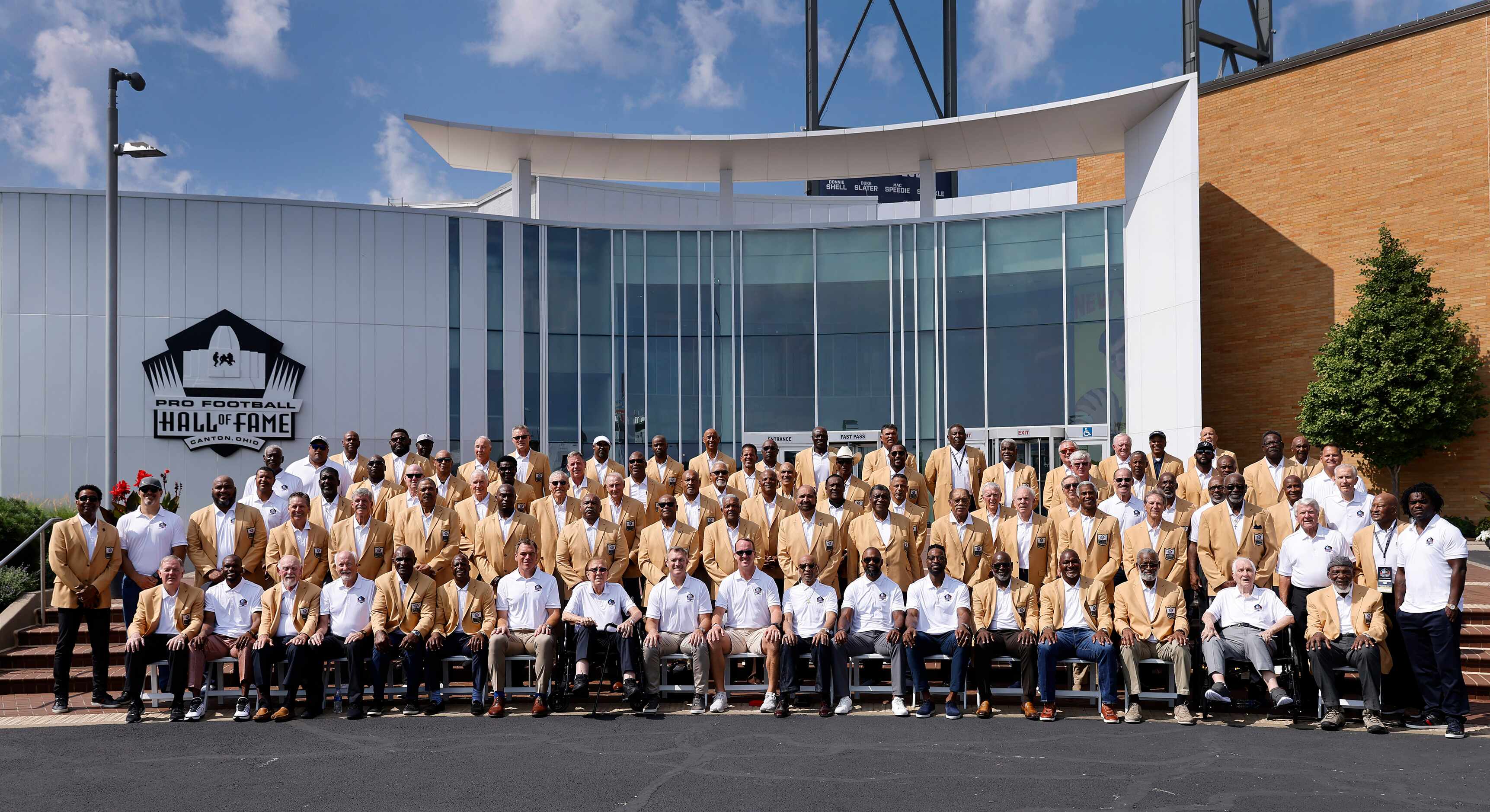 The Pro Football Hall of Fame inductees of the 2020 and 2021 classes (wearing white shirts)...