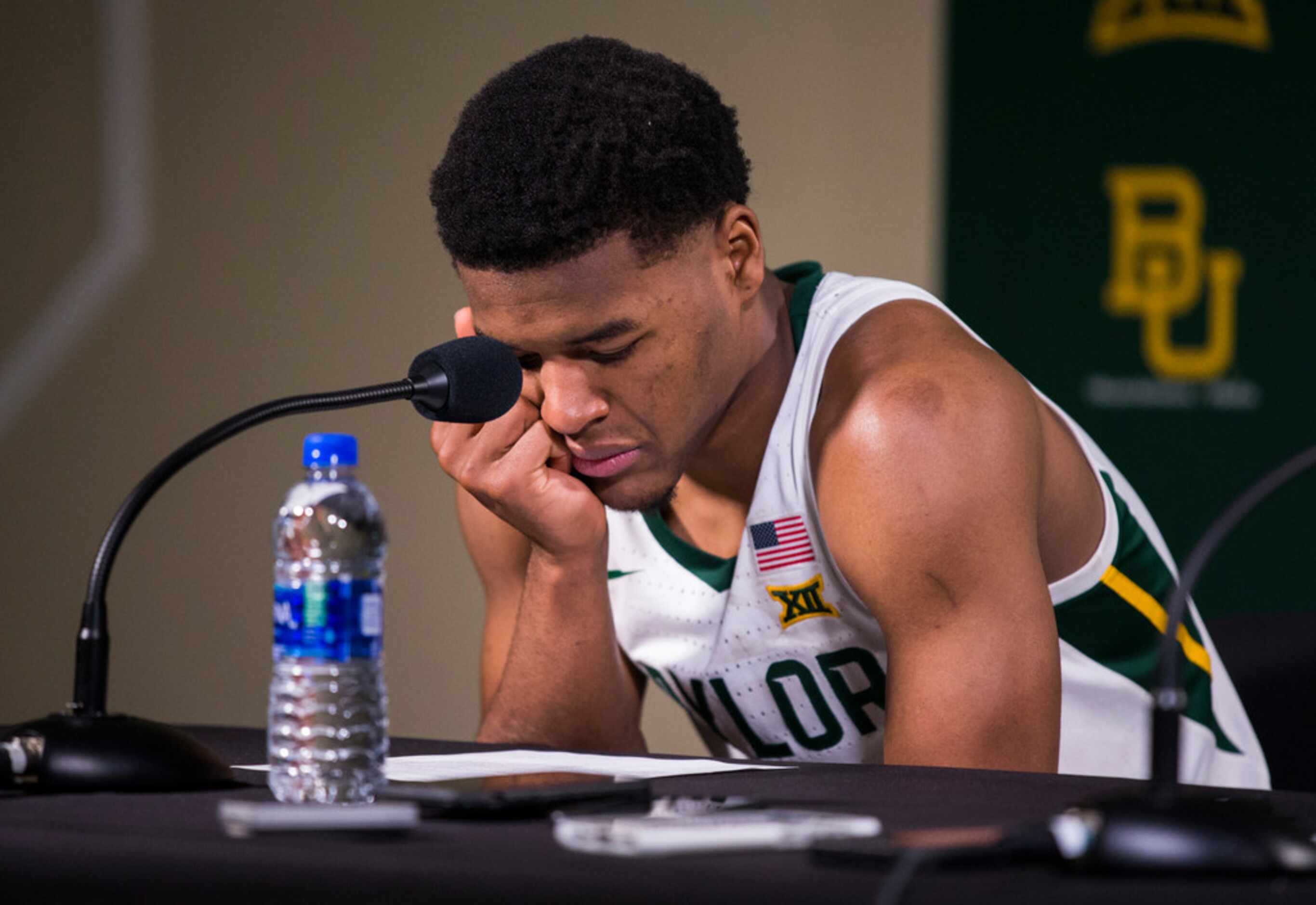 Baylor Bears guard Jared Butler (12) reacts as he speaks to reporters after a 64-61 loss to...