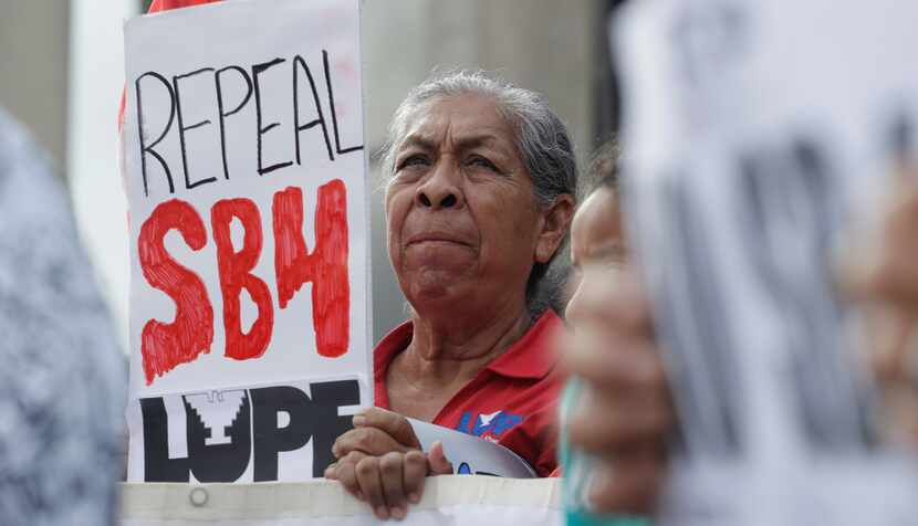 Protesters gathered outside the federal courthouse in San Antonio in June to oppose a new...