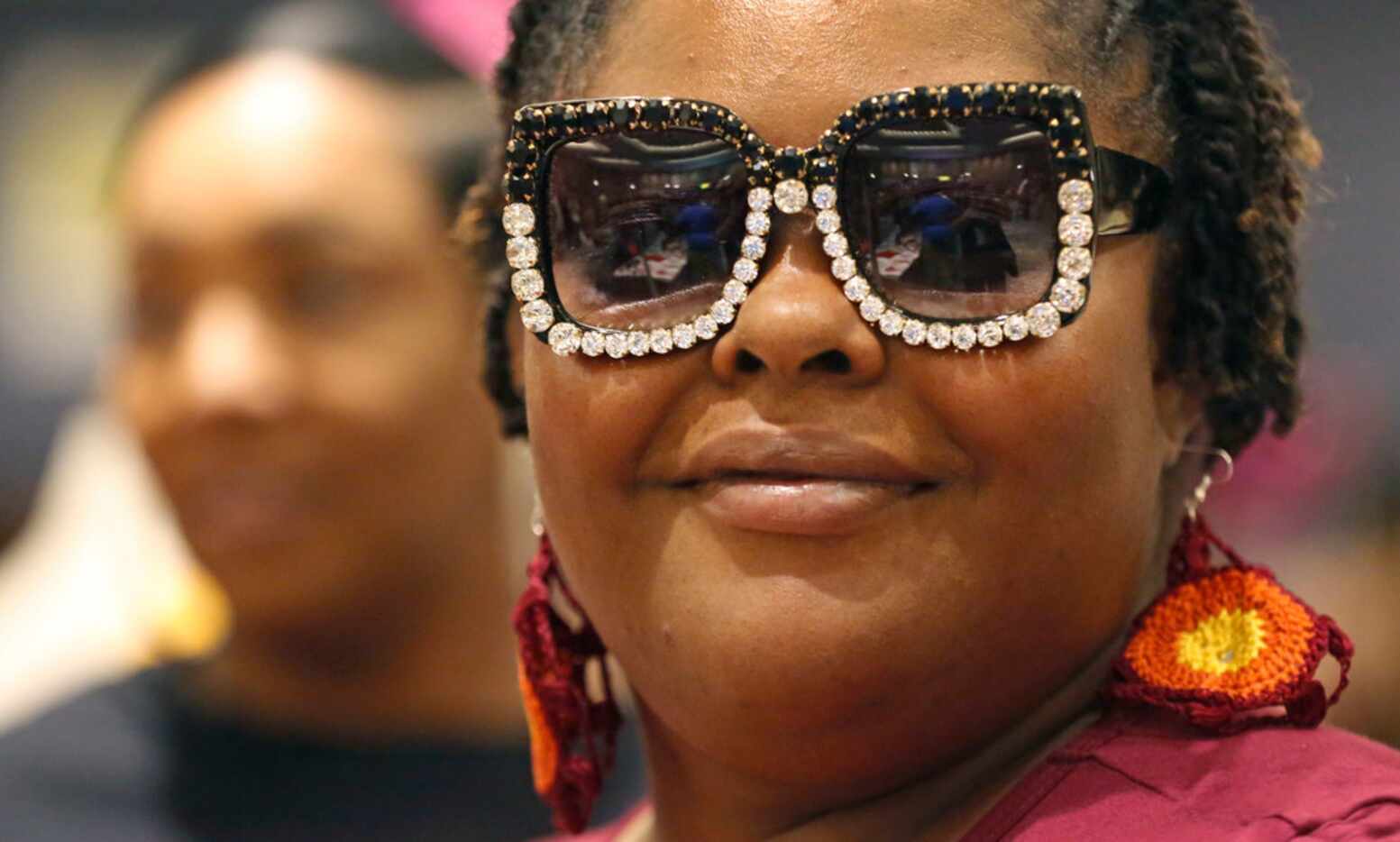 Katrina Whitfield tries on some stylish sunglasses during the Afrolicious Hair and Beauty...