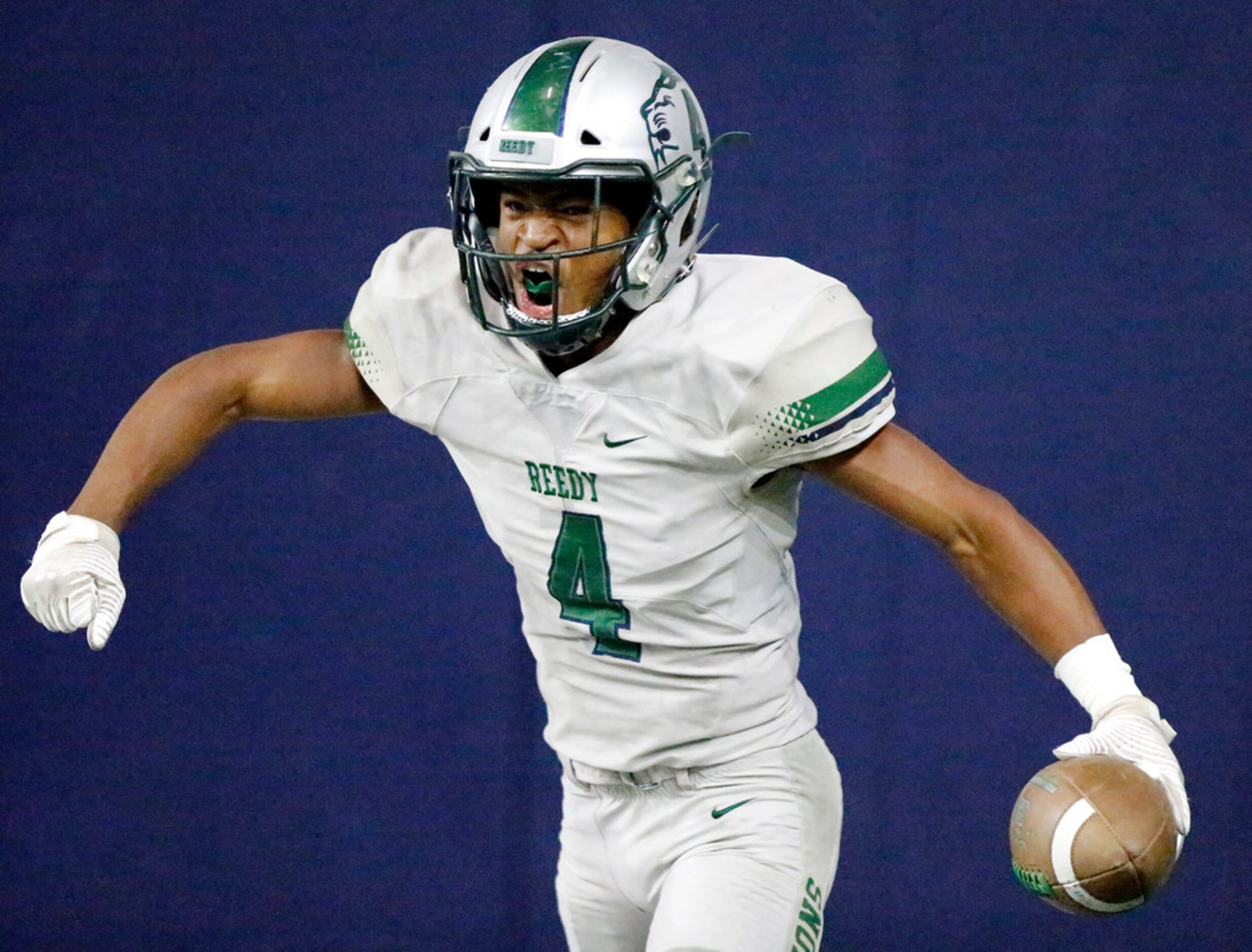 Frisco High School Chase Lowery (4) celebrates scoring a touchdown during the second half as...