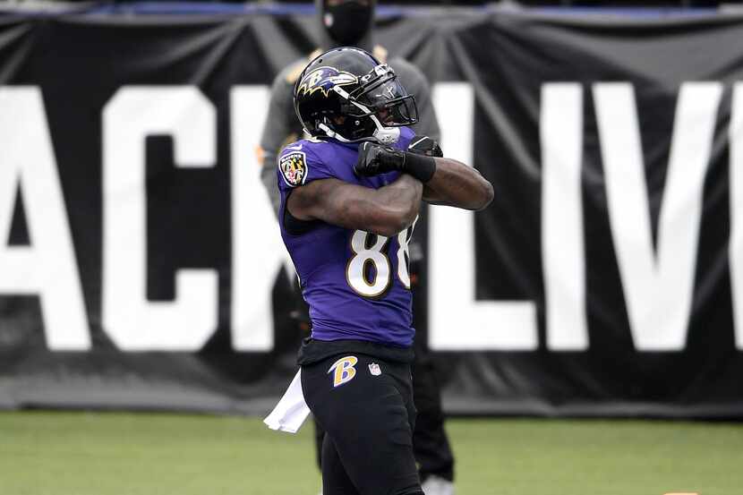 Baltimore Ravens wide receiver Dez Bryant reacts after scoring a touchdown against the...