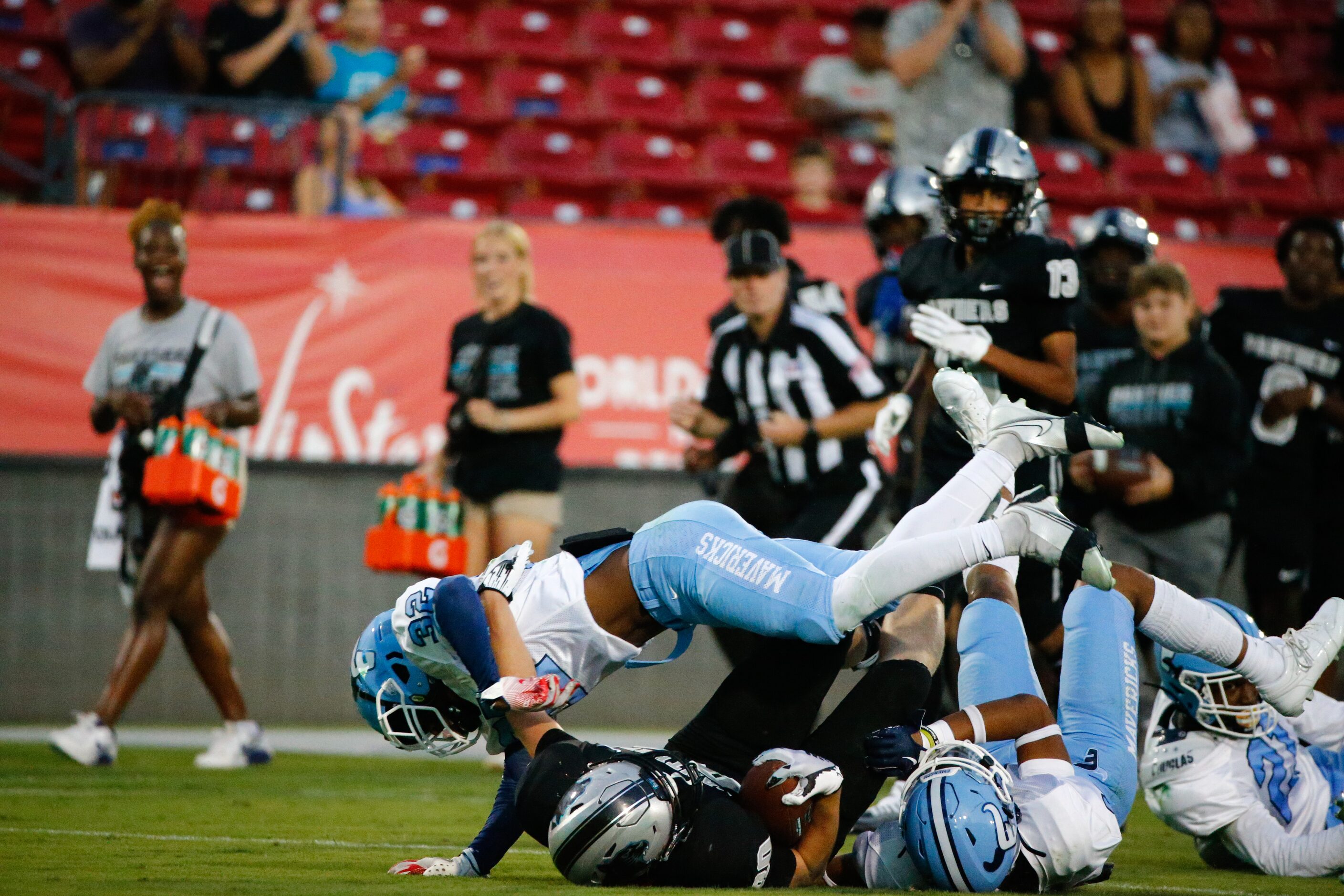 Emerson Mavericks defenders tackle Panther Creek Panthers wide receiver Miles Meldrum (80) ...