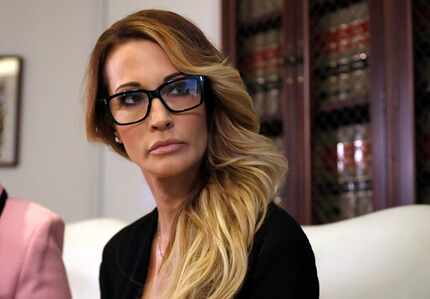 Jessica Drake listens to a question during a news conference at the office of her attorney,...